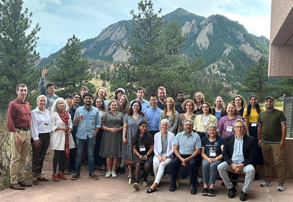 group of students with mountains in the background